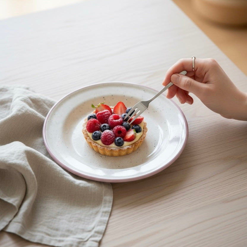 Blush speckled enamel plate on breakfast table