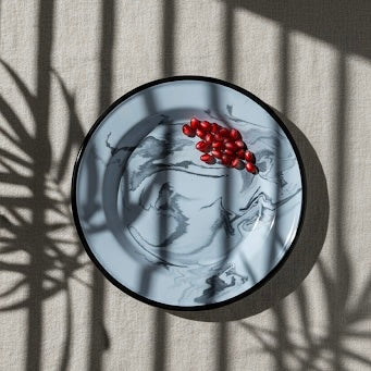 Blue swirl enamel side plate in shadow plants